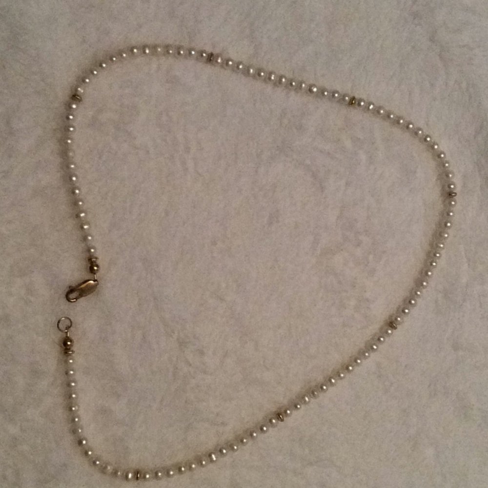 Faux pearl necklace.